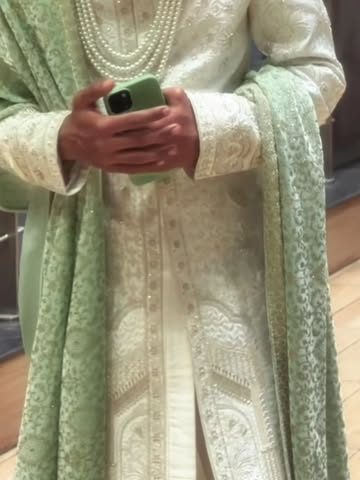 Mint sherwani with dupatta from Praveen's